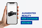 Hand probiert Augmented Reality bei Outdoorküche.