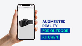 Hand tries out augmented reality at Outdoor Kitchen.