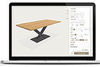 Laptop with a screenshot of a table configurator.
