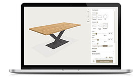 Laptop with a screenshot of a table configurator.