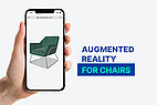 Hand tries augmented reality with armchairs.