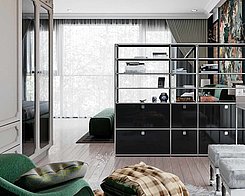 black Swissmobilia shelf next to green armchair