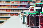 Jam jars on a supermarket shelf