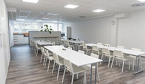 Kitchen with white furniture.