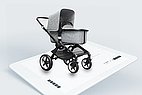 Gray stroller on a tablet