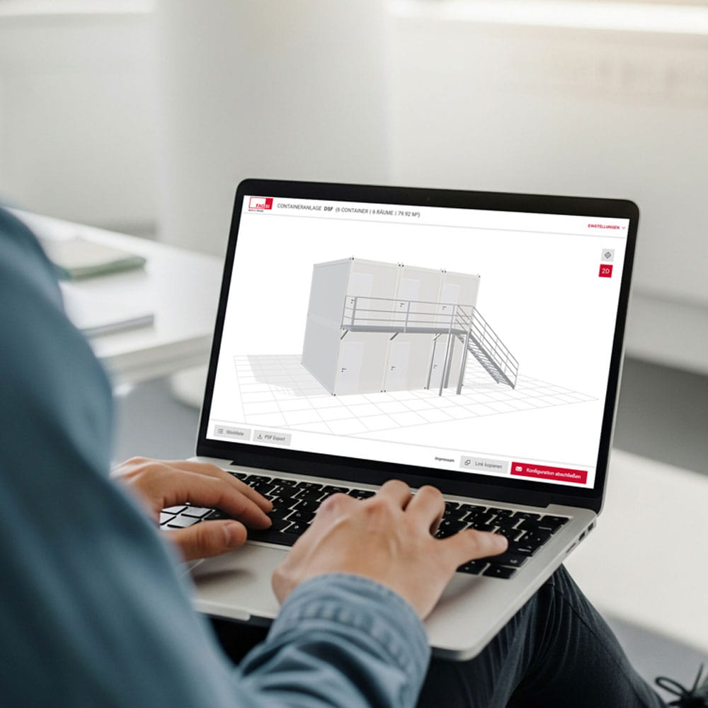 A person is using the Fagsi container configurator on a laptop.