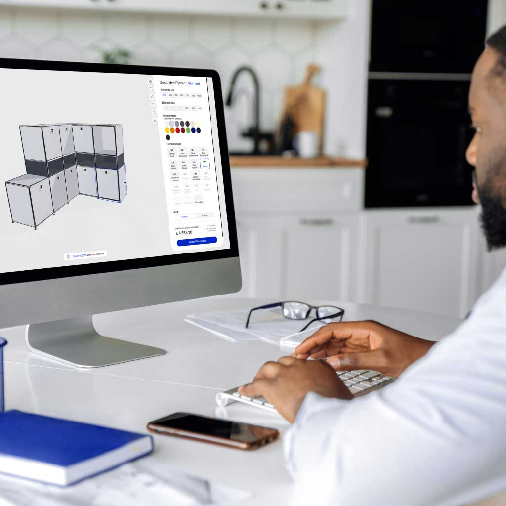 Person configures modular shelving system on the computer.